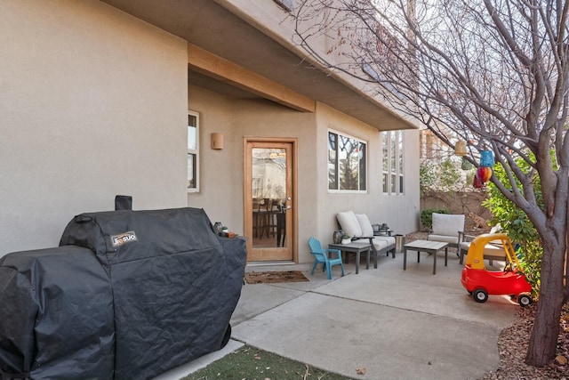 view of patio with a grill and fence