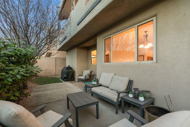 view of patio / terrace featuring outdoor lounge area and fence