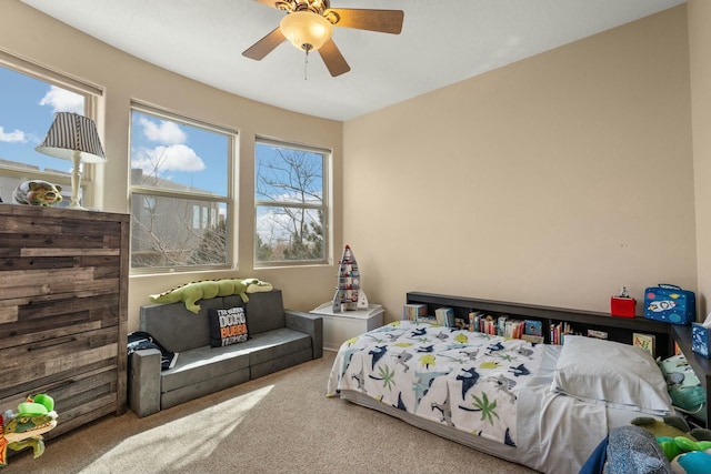 carpeted bedroom featuring ceiling fan