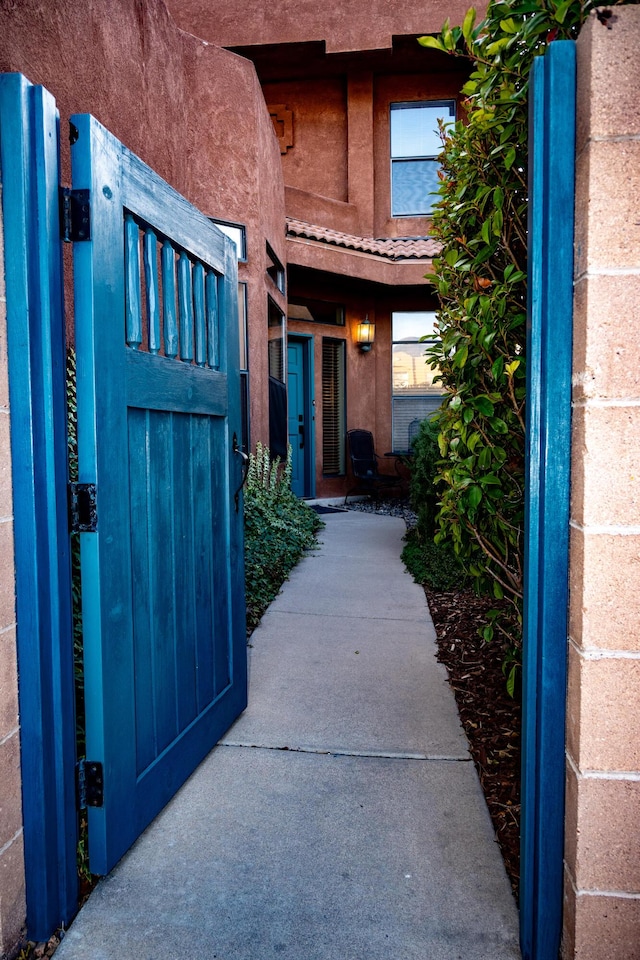 entrance to property with stucco siding