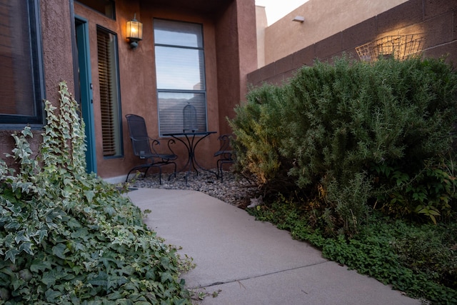 doorway to property featuring stucco siding