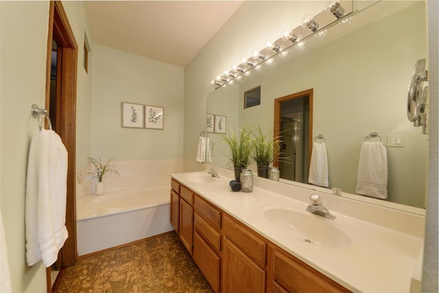 bathroom featuring double vanity, a sink, a bath, and a shower with door