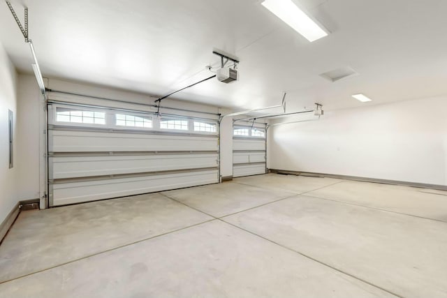 garage featuring baseboards and a garage door opener