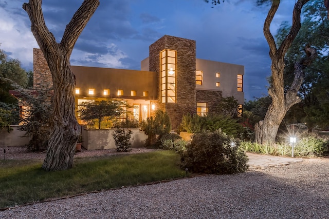 exterior space featuring stone siding