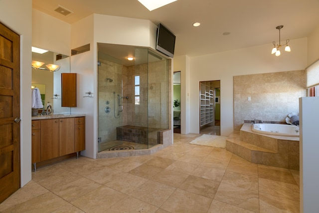 bathroom with a garden tub, visible vents, vanity, a shower stall, and tile patterned floors