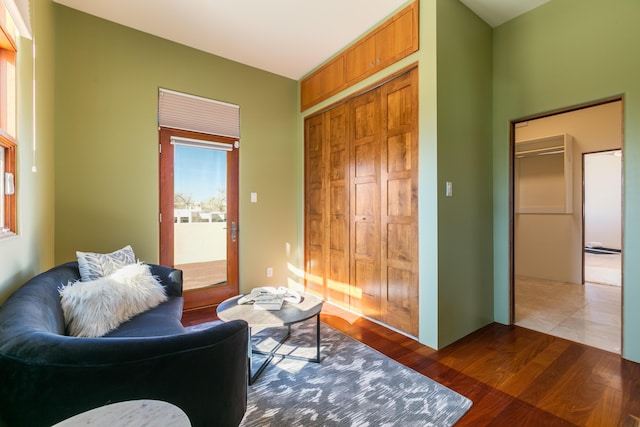 sitting room featuring dark wood-style flooring