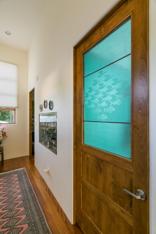 doorway featuring wood finished floors