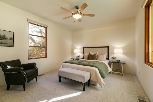 bedroom featuring visible vents and ceiling fan