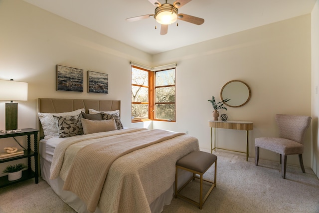 bedroom featuring a ceiling fan and light colored carpet