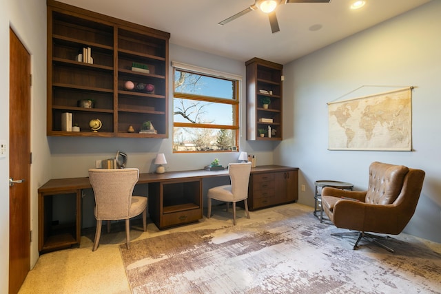 office area featuring a ceiling fan and built in study area