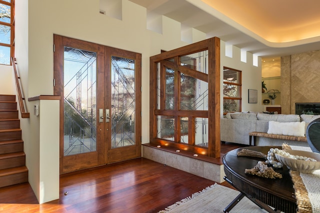 927 Camino Vista Rio, Bernalillo, NM 87004 - doorway featuring wood finished floors, stairway, french doors, a high end fireplace, and a high ceiling
