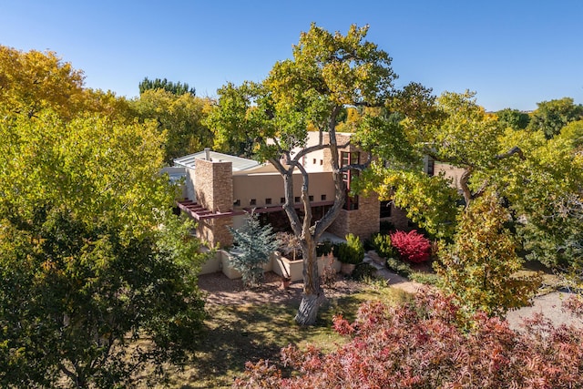 view of side of home with stucco siding