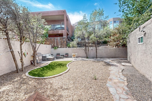 view of yard featuring a patio area and a fenced backyard