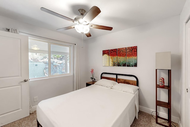 bedroom featuring light carpet, ceiling fan, and baseboards