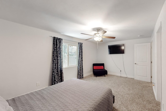 bedroom featuring a ceiling fan, baseboards, and carpet flooring