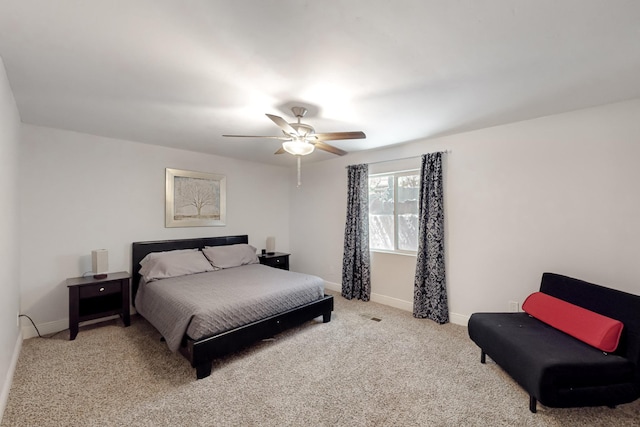 bedroom with carpet floors, a ceiling fan, and baseboards