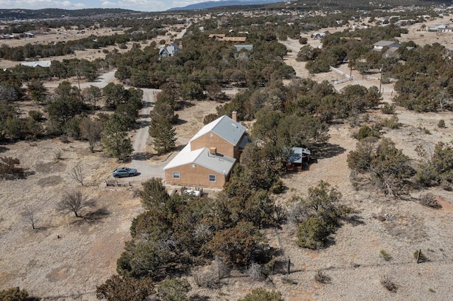 aerial view featuring a mountain view and view of desert