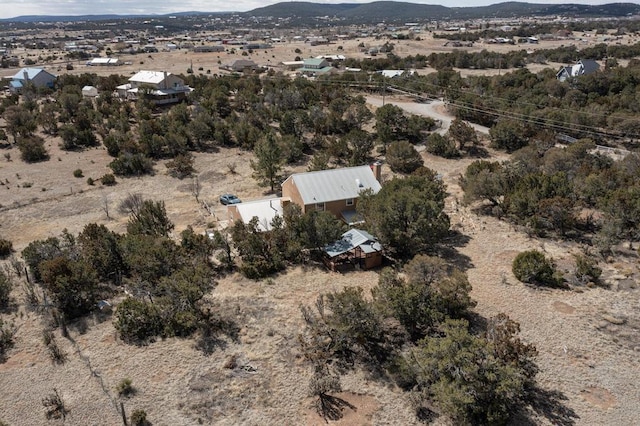 aerial view featuring a mountain view and view of desert