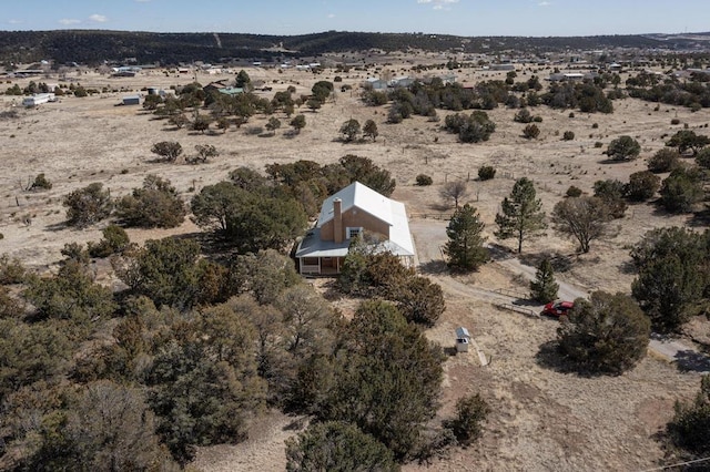 birds eye view of property with a desert view