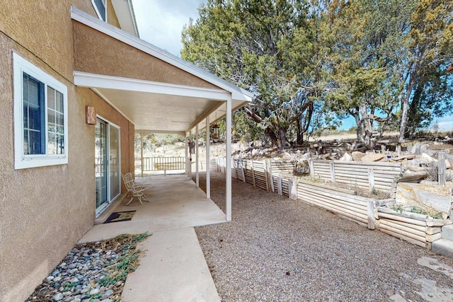 view of patio / terrace featuring fence