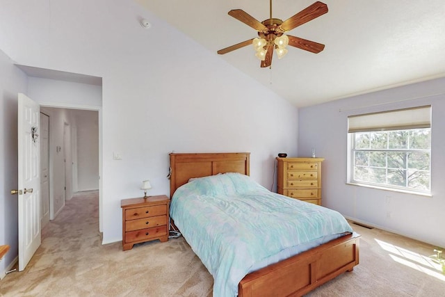 bedroom featuring light carpet, visible vents, ceiling fan, and vaulted ceiling