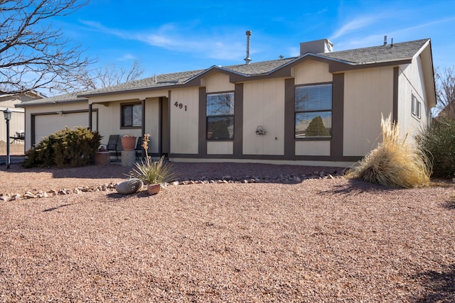 ranch-style home featuring an attached garage