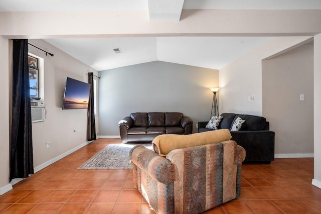 living area with cooling unit, vaulted ceiling, baseboards, and light tile patterned floors