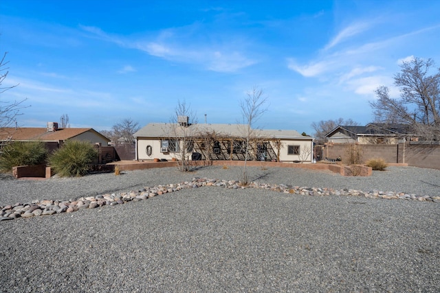 view of front of house featuring fence