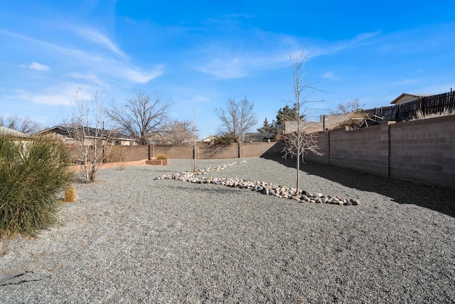 view of yard featuring a fenced backyard