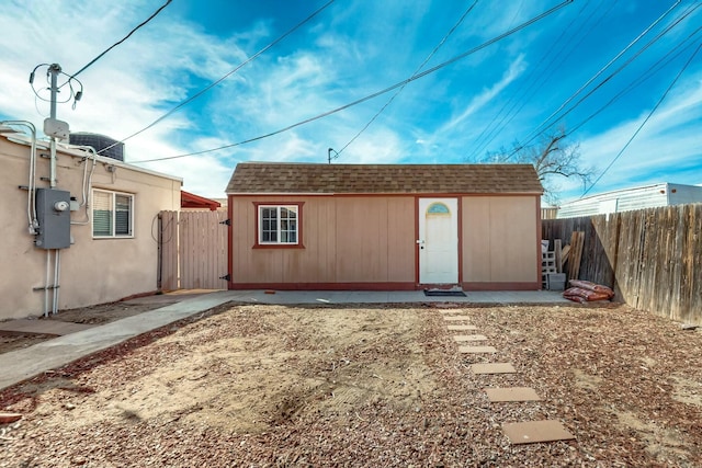 view of outdoor structure with a fenced backyard and an outdoor structure