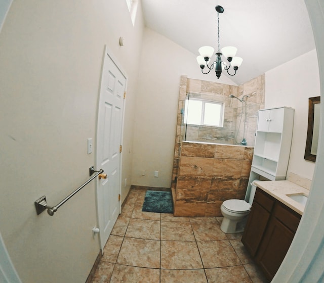 full bath featuring a chandelier, toilet, vanity, vaulted ceiling, and walk in shower