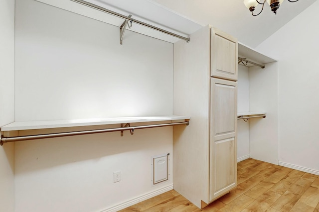 walk in closet featuring light wood-style flooring