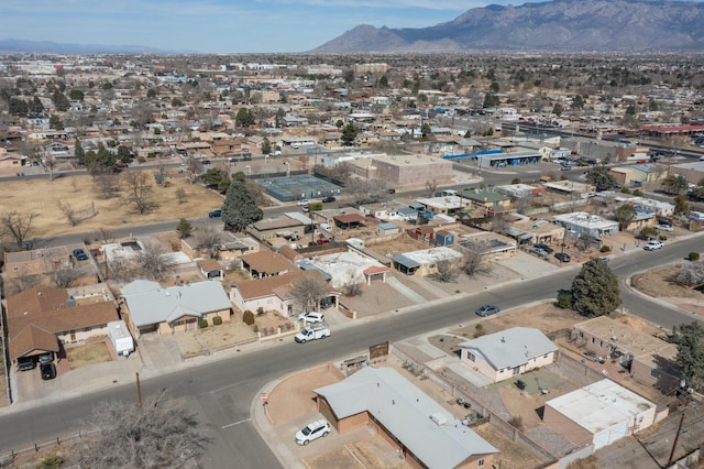 birds eye view of property with a mountain view