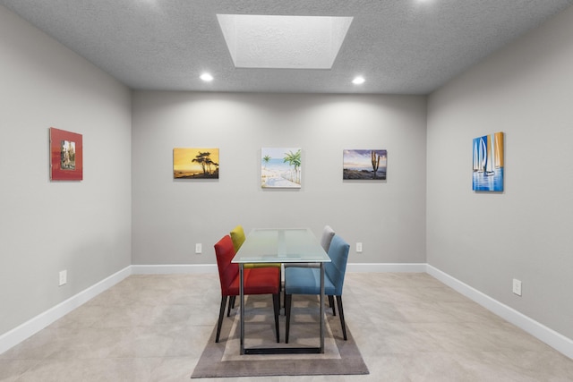 dining area featuring recessed lighting, a textured ceiling, and baseboards