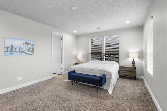 bedroom with recessed lighting, visible vents, carpet floors, and baseboards