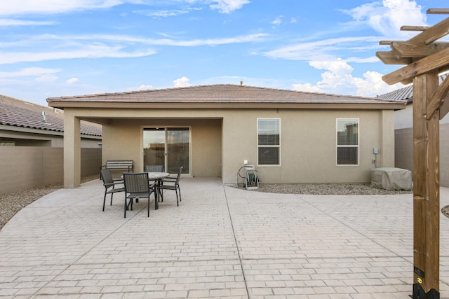 view of patio / terrace with outdoor dining space and fence