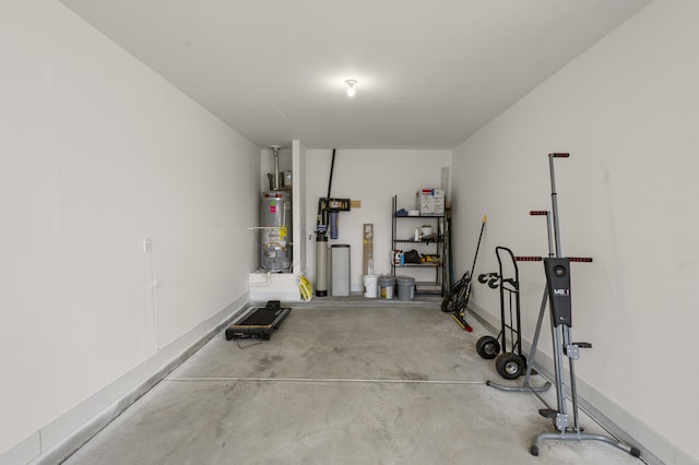 garage with water heater and baseboards