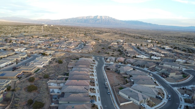 birds eye view of property featuring a residential view, a mountain view, and a desert view