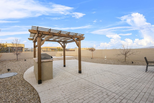 view of patio featuring area for grilling, a fenced backyard, and a pergola