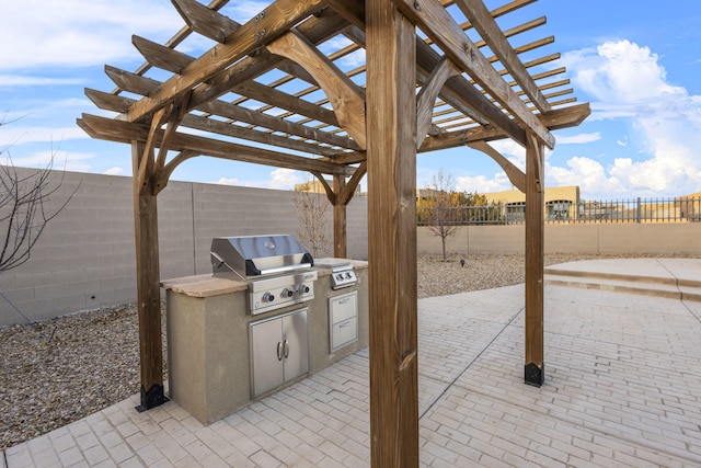 view of patio with area for grilling, a fenced backyard, and a pergola