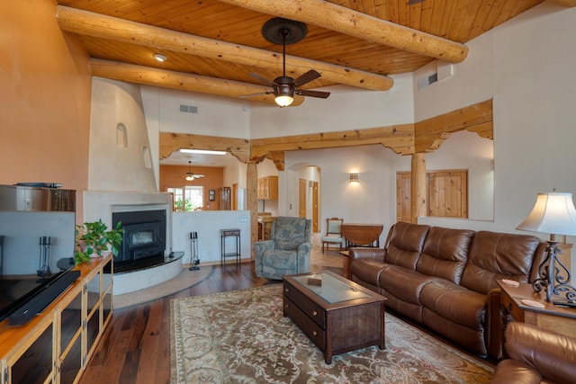 living area featuring wood ceiling, beam ceiling, wood-type flooring, and visible vents