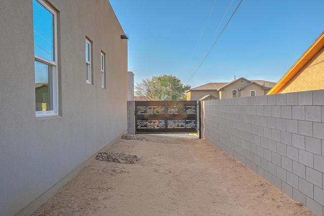 view of yard with a gate and fence