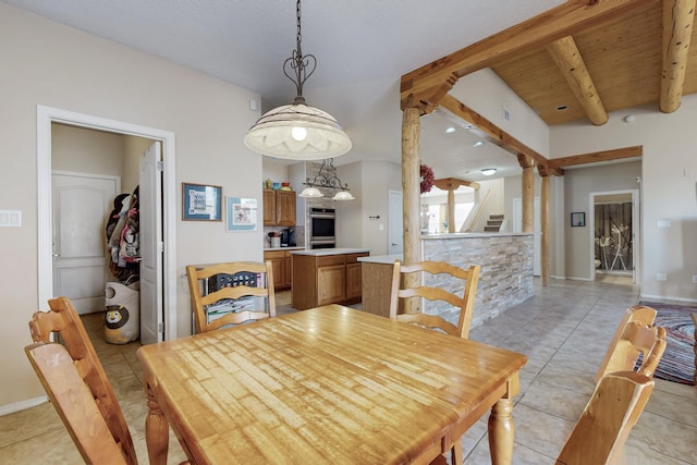 dining area featuring light tile patterned floors, beamed ceiling, baseboards, and stairway