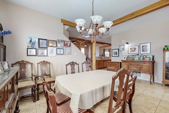 dining space with light tile patterned floors, beamed ceiling, baseboards, and a chandelier