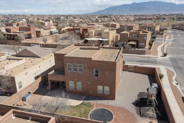 drone / aerial view featuring a mountain view and a residential view