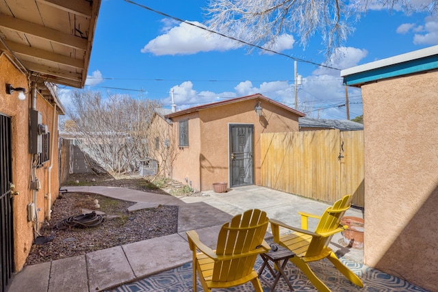 view of patio / terrace featuring fence