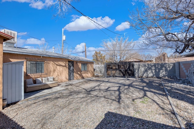 exterior space featuring fence and stucco siding