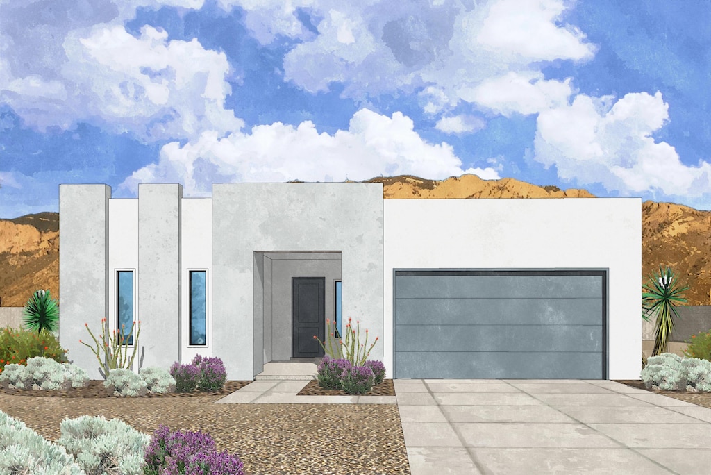 contemporary home featuring driveway, an attached garage, and stucco siding