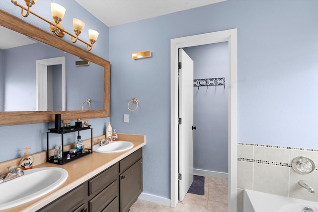 bathroom with a tub, tile patterned flooring, a sink, and double vanity