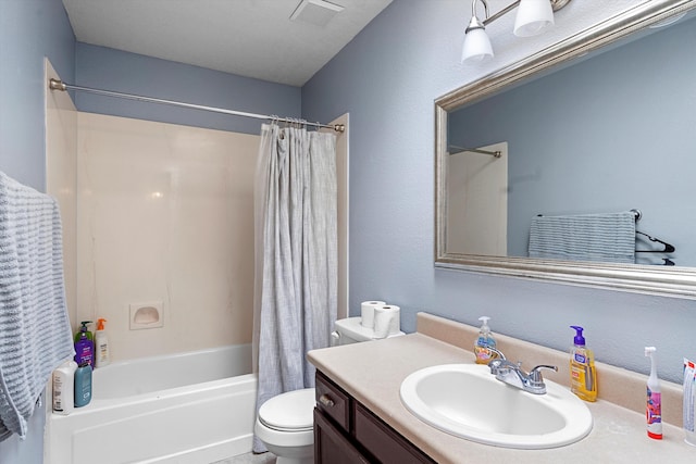 bathroom featuring shower / bath combination with curtain, visible vents, vanity, and toilet